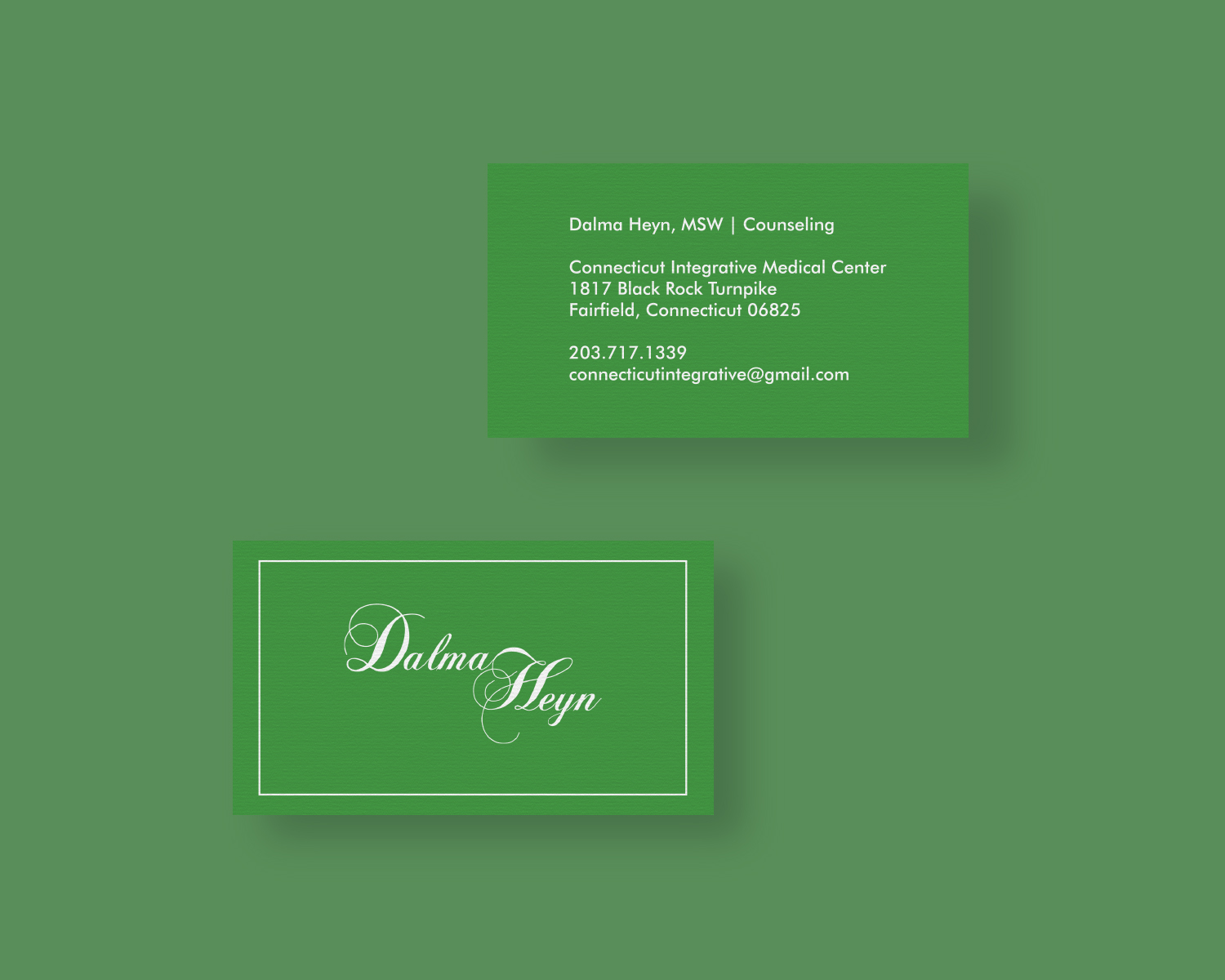 front and back of a business card on a green background